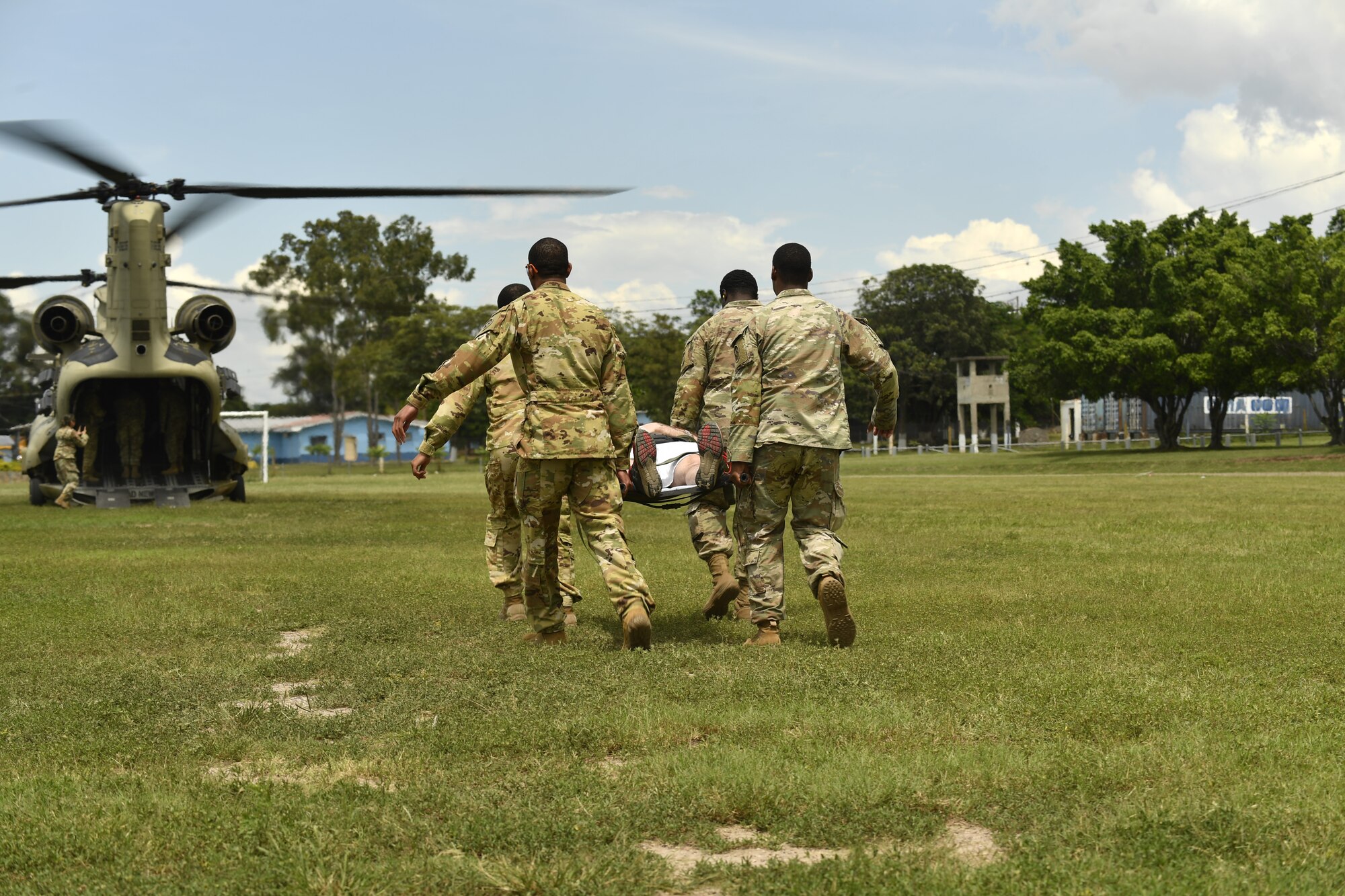 U.S. Army soldiers simulate a medical evacuation during an exercise following the Medical Effects of Ionizing Radiation course at Soto Cano Air Base, Honduras on 14 Oct 2022.