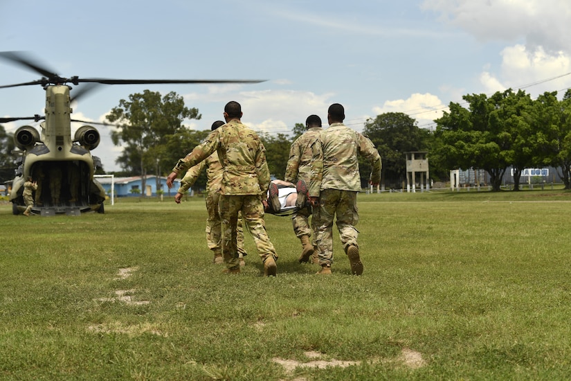U.S. Army soldiers simulate a medical evacuation during an exercise following the Medical Effects of Ionizing Radiation course at Soto Cano Air Base, Honduras on 14 Oct 2022.