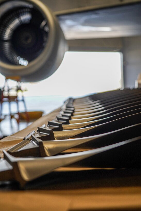 Fan blades from a KC-135 Stratotanker engine are lined up on a table in a hangar at Niagara Falls Air Reserve Station, New York, on Oct. 14, 2022. The engine is undergoing repair following a bird strike while on a previous mission. (U.S. Air Force photo by 1st Lt. Lucas Morrow)