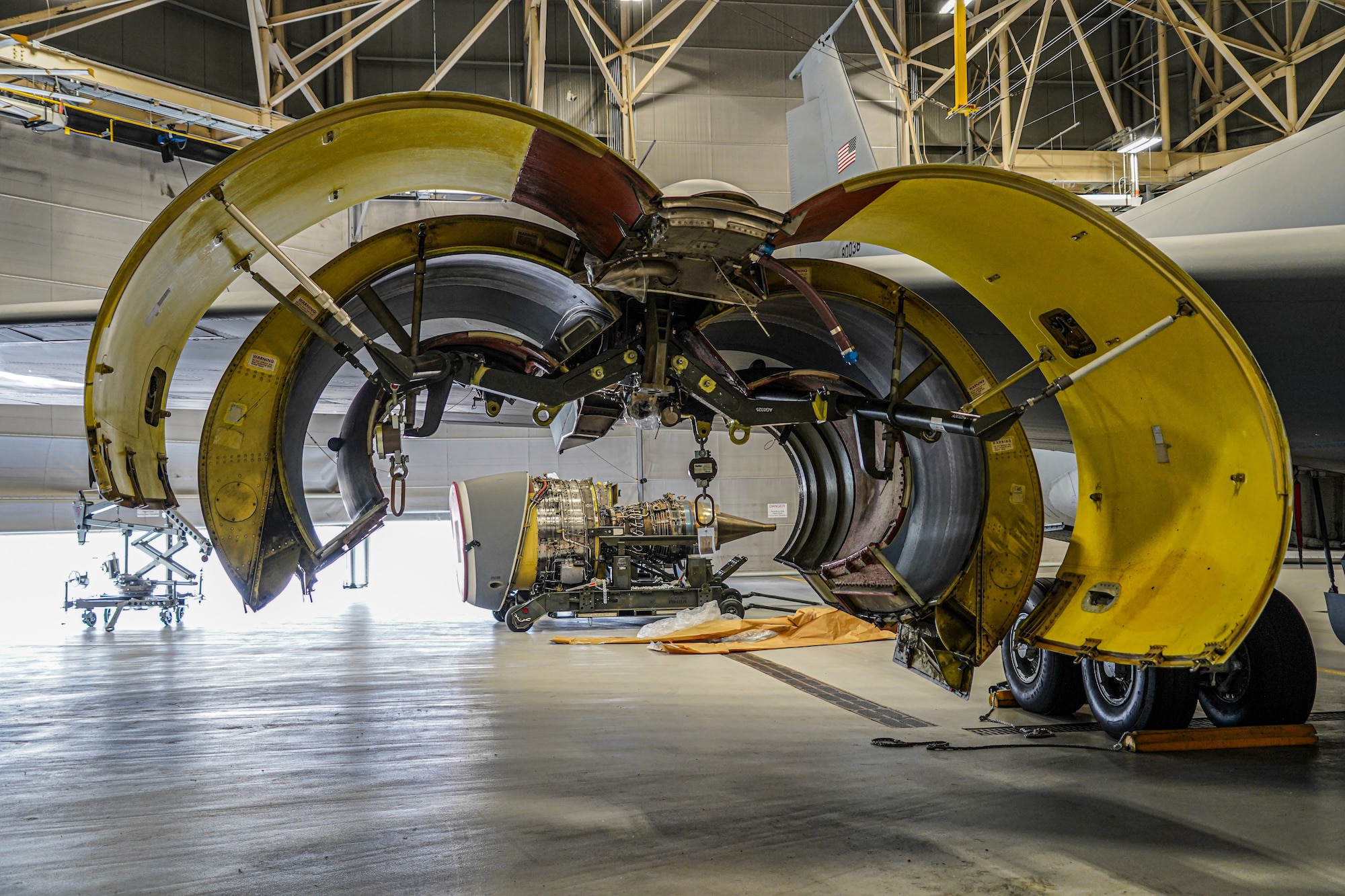 A KC-135 Stratotanker assigned to the 914th Air Refueling Wing at Niagara Falls Air Reserve Station, New York, sits in a hangar with one of its engines removed on Oct. 17, 2022. The Stratotanker was involved in a bird strike which caused the aircraft to undergo repair so it can once again be mission ready. (U.S. Air Force photo by 1st Lt. Lucas Morrow)