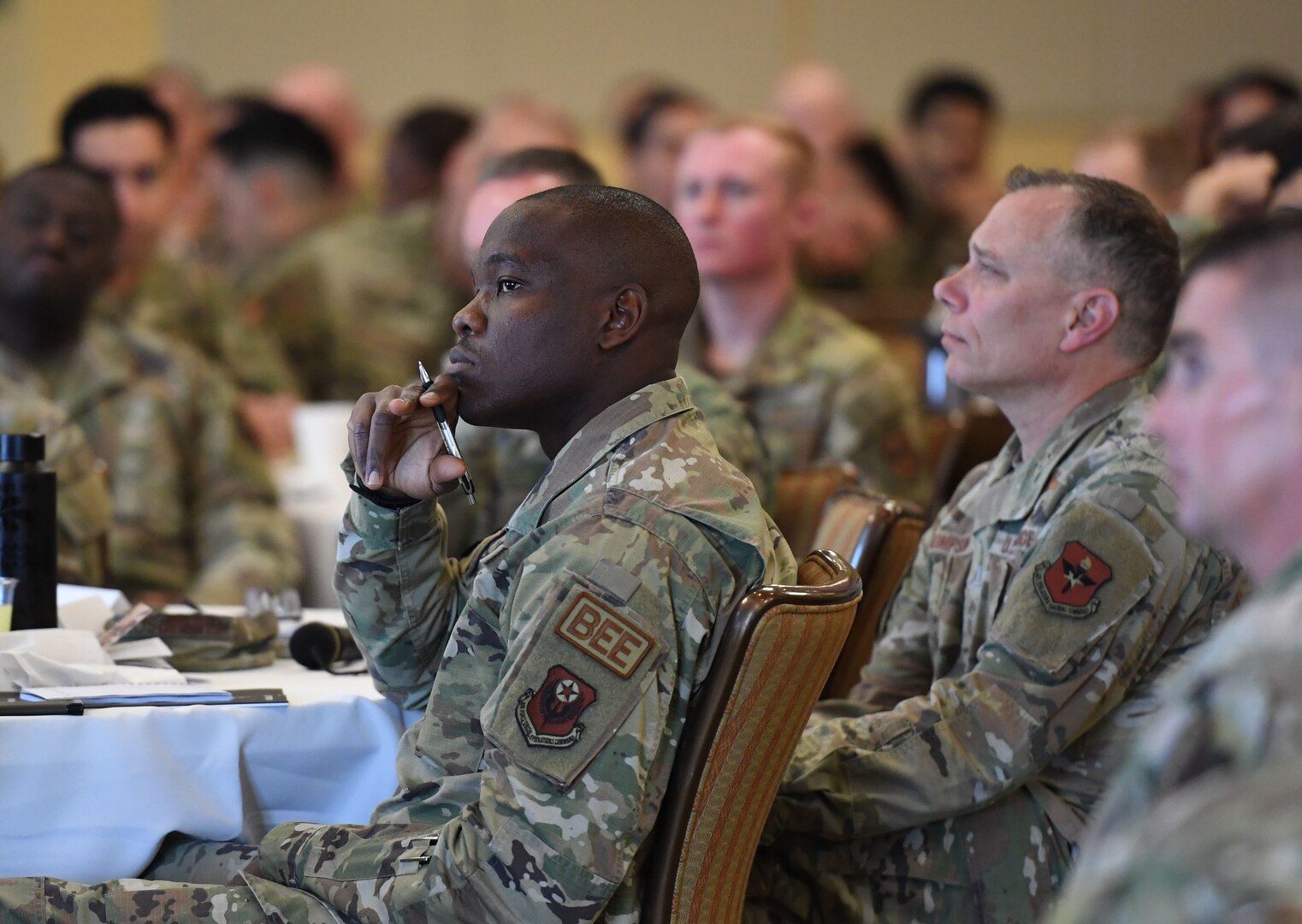 U.S. Air Force Airman 1st Class Bamowo Okunowo, 1st Special Operations Medical Readiness Squadron bioenvironmental engineering technician, listens to the 'emotional intelligence' briefing during the inaugural Torch and Dagger professional development seminar at Keesler Air Force Base, Mississippi, October 14, 2022.