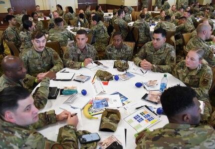 Airmen work together during the Air Force Specialty Code working group portion of the inaugural Torch and Dagger professional development seminar at Keesler Air Force Base, Mississippi, October 13, 2022