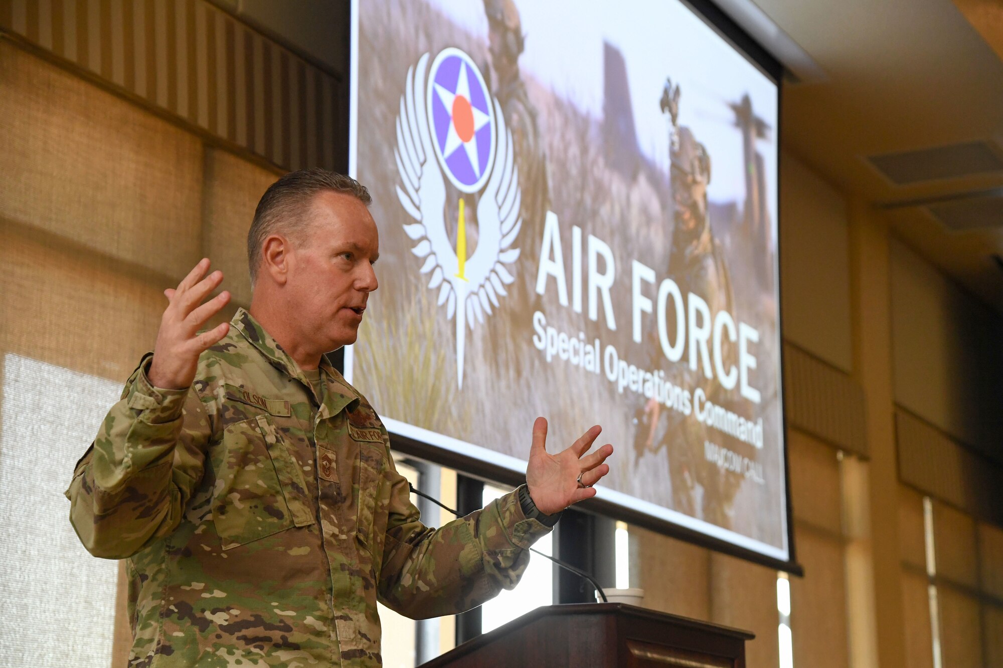 U.S. Air Force Chief Master Sgt. Cory Olson, command chief of Air Force Special Operations Command, delivers remarks during an AFSOC all-call during the inaugural Torch and Dagger professional development seminar at Keesler Air Force Base, Mississippi, Oct. 15, 2022.