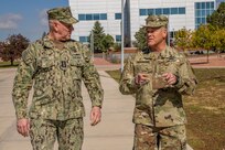 U.S. Army Gen. James Dickinson, U.S. Space Command commander, talks with U.S. Navy Adm. Christopher Grady, Vice Chairman of the Joint Chiefs of Staff, Oct. 17, 2022, at Peterson Space Force Base, Colo.