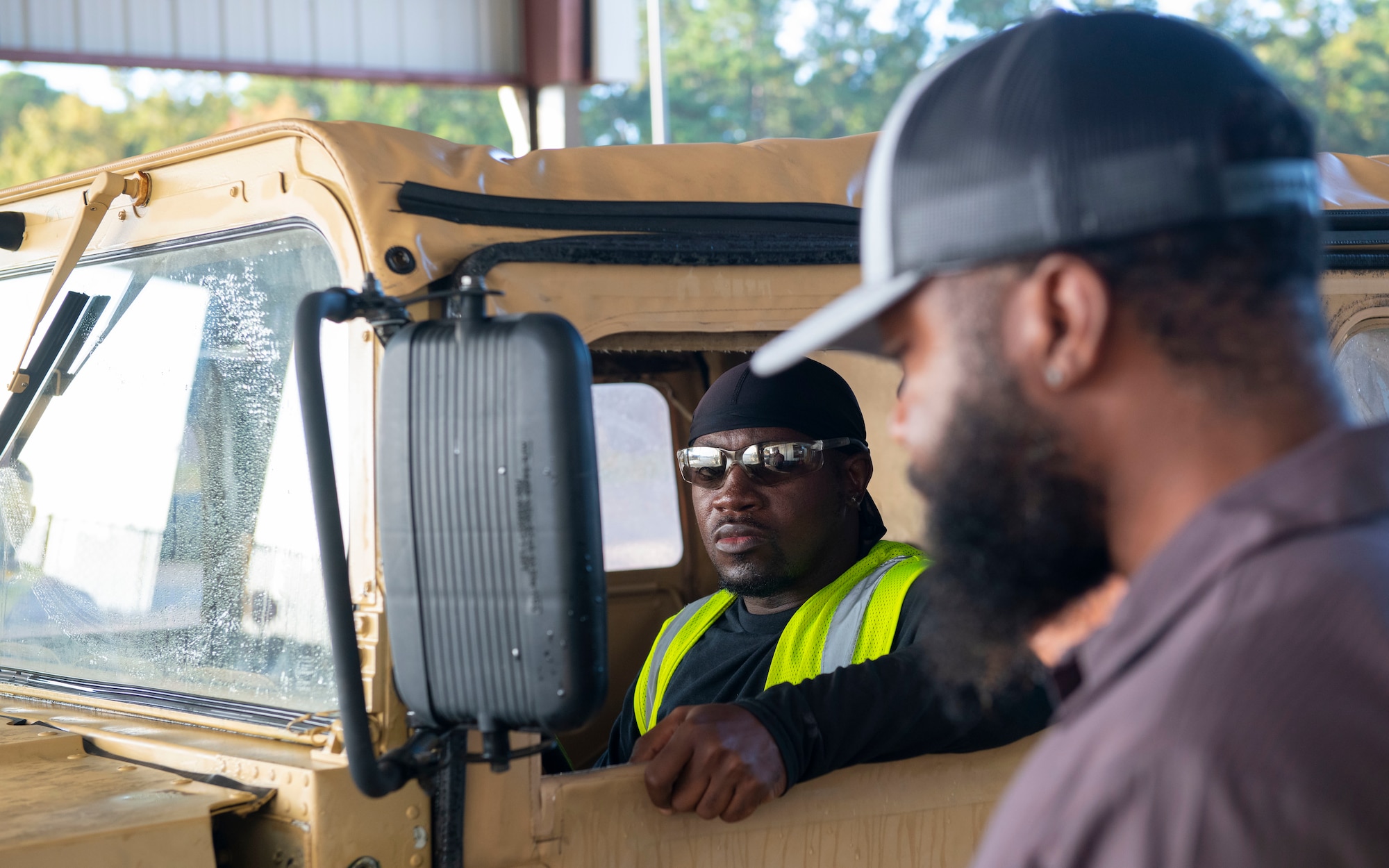 Air Force personal inspects a Humvee