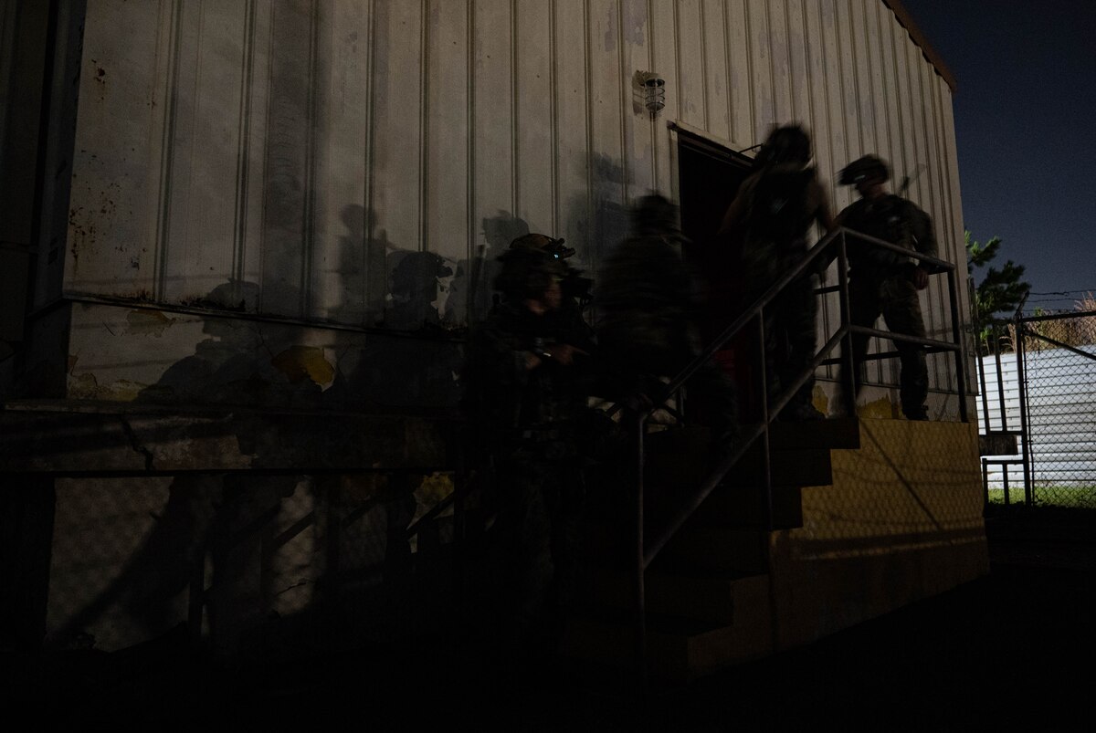 Operators participating in joint training between U.S. and Republic of Korea (ROK) special operations forces, prepare to breach a building