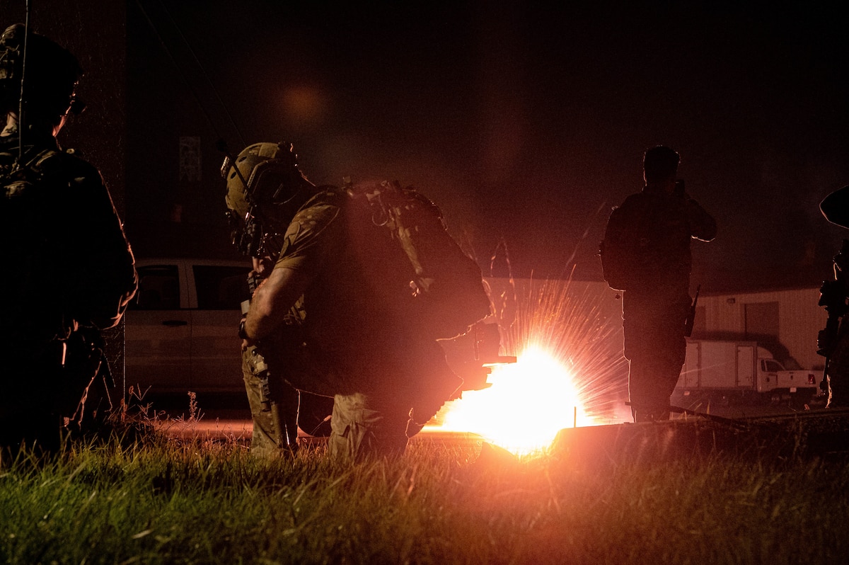 Operators participating in joint training between U.S. and Republic of Korea (ROK) special operations forces, take cover as mock explosives detonate