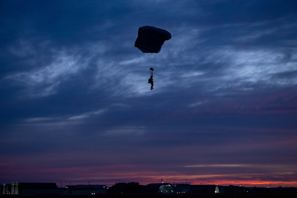 An operator participating in joint training between U.S. and Republic of Korea (ROK) special operations forces, parachutes in at dusk