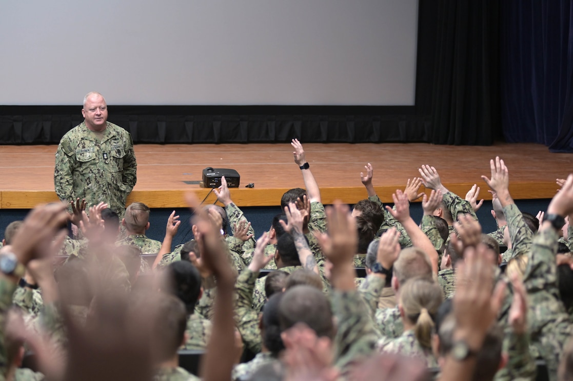 Master Chief Petty Officer of the Navy James Honea asks a question during an all-hands call at Naval Submarine Base Kings Bay, Oct. 17, 2022.