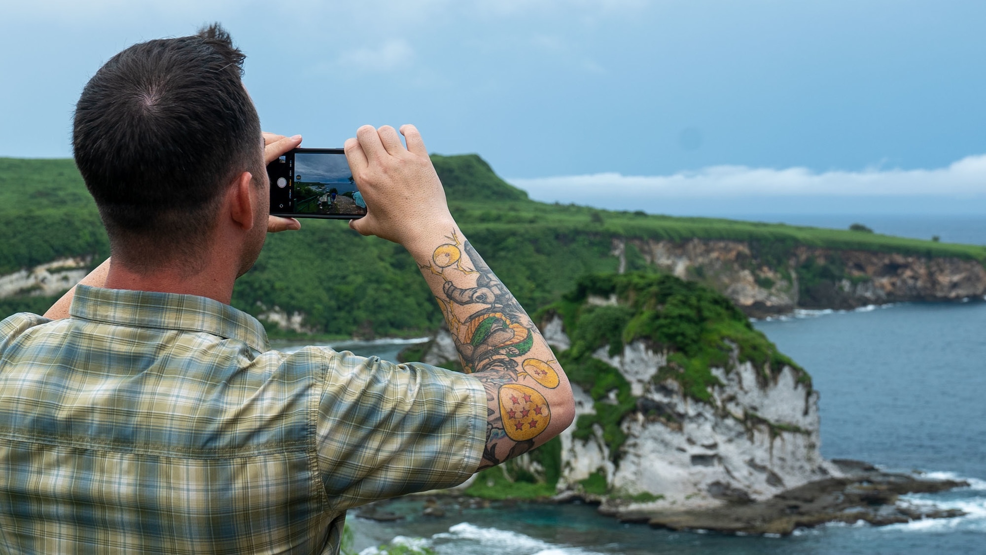 A member assigned to the 36th Wing takes a photo while on a historical tour during an off-site in Saipan on Oct. 13, 2022.  The off-site provided leadership with the opportunity to discuss realigning the wing’s mission, vision and priorities as well as tour various historical sites on the island. (U.S. Air Force photo by 1st Lt. Jade Watkins)