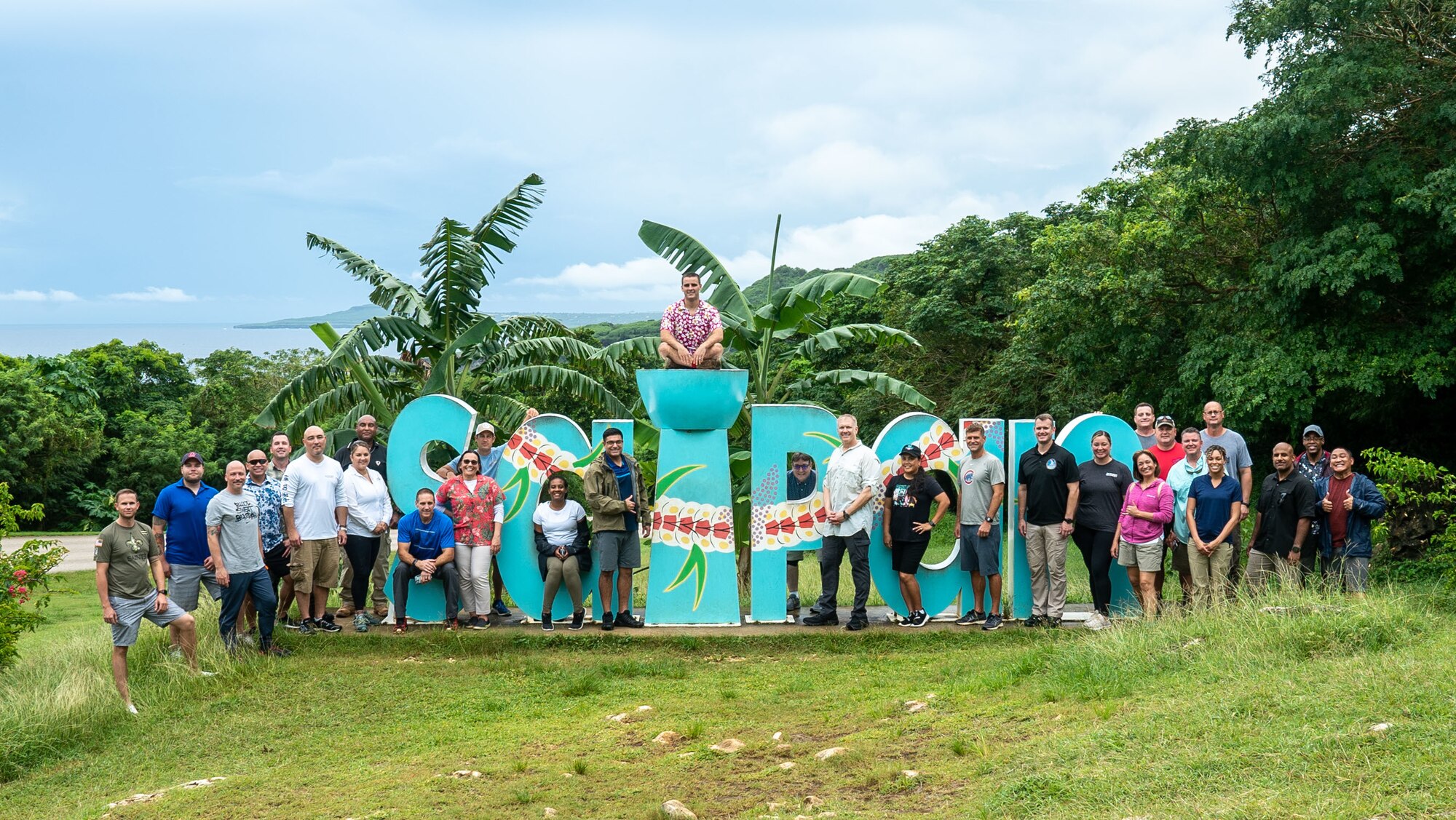 36th Wing leadership pose in front of a welcome sign during an off-site at Saipan on Oct. 13, 2022.  The off-site provided leadership with the opportunity to discuss realigning the wing’s mission, vision and priorities as well as tour various historical sites on the island. (U.S. Air Force photo by 1st Lt. Jade Watkins)