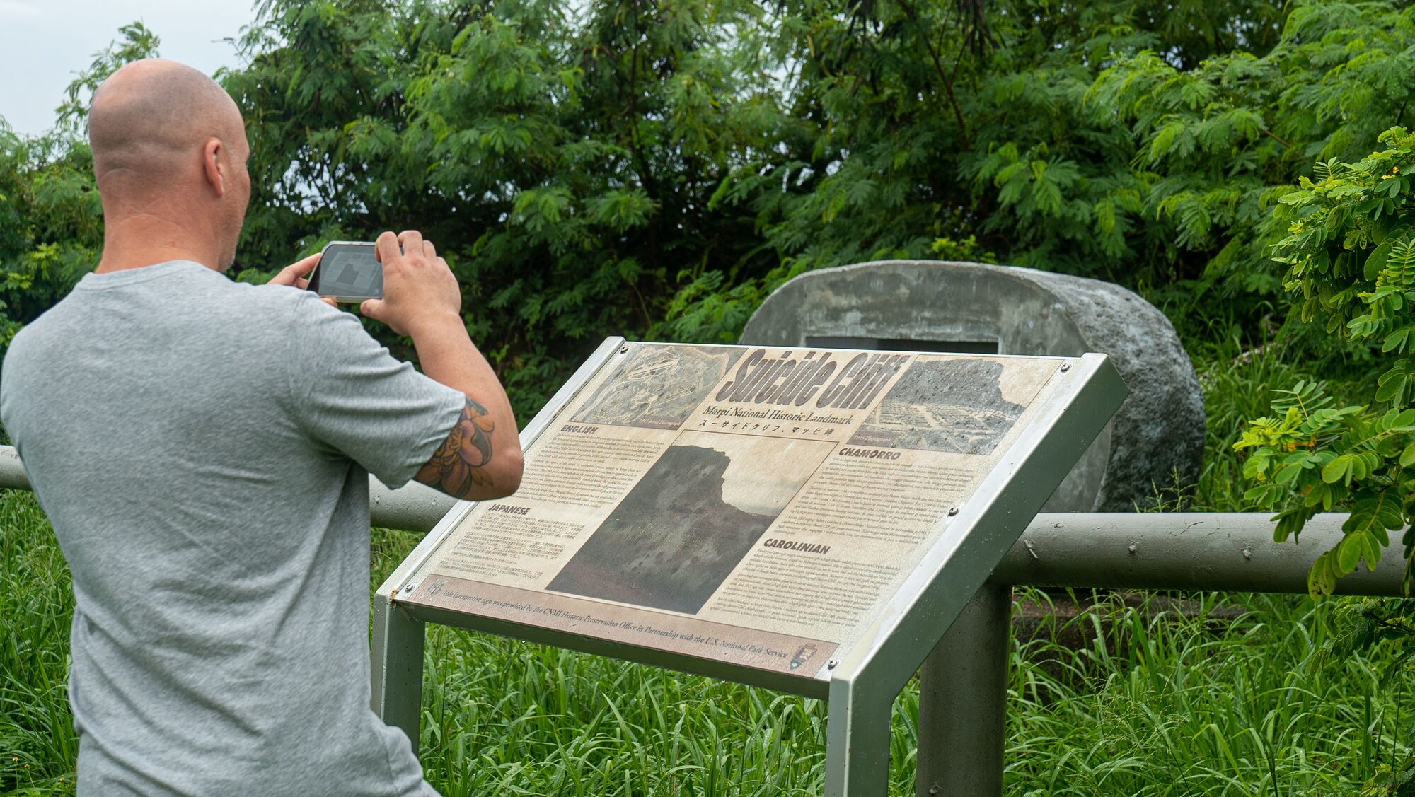 A member assigned to the 36th Wing takes a photo while on a historical tour during an off-site in Saipan on Oct. 13, 2022.  The off-site provided leadership with the opportunity to discuss realigning the wing’s mission, vision and priorities as well as tour various historical sites on the island. (U.S. Air Force photo by 1st Lt. Jade Watkins)