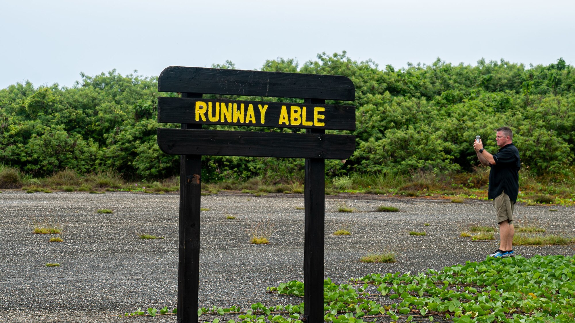 Col. Kenneth Herndon, 36th Mission Support Group commander, takes a photo of Runway Able during an off-site at Tinian on Oct. 11, 2022.  During the off-site, leadership spent time viewing historical sites from World War II and met with Tinian’s mayor and local government to solidify relationships and improve their ability to mutually support one another. (U.S. Air Force photo by 1st Lt. Jade Watkins)