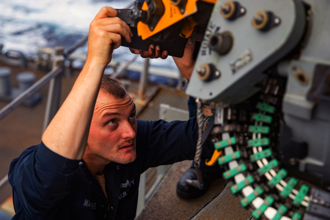 A sailor loads the ship’s aft Phalanx close-in weapons system.