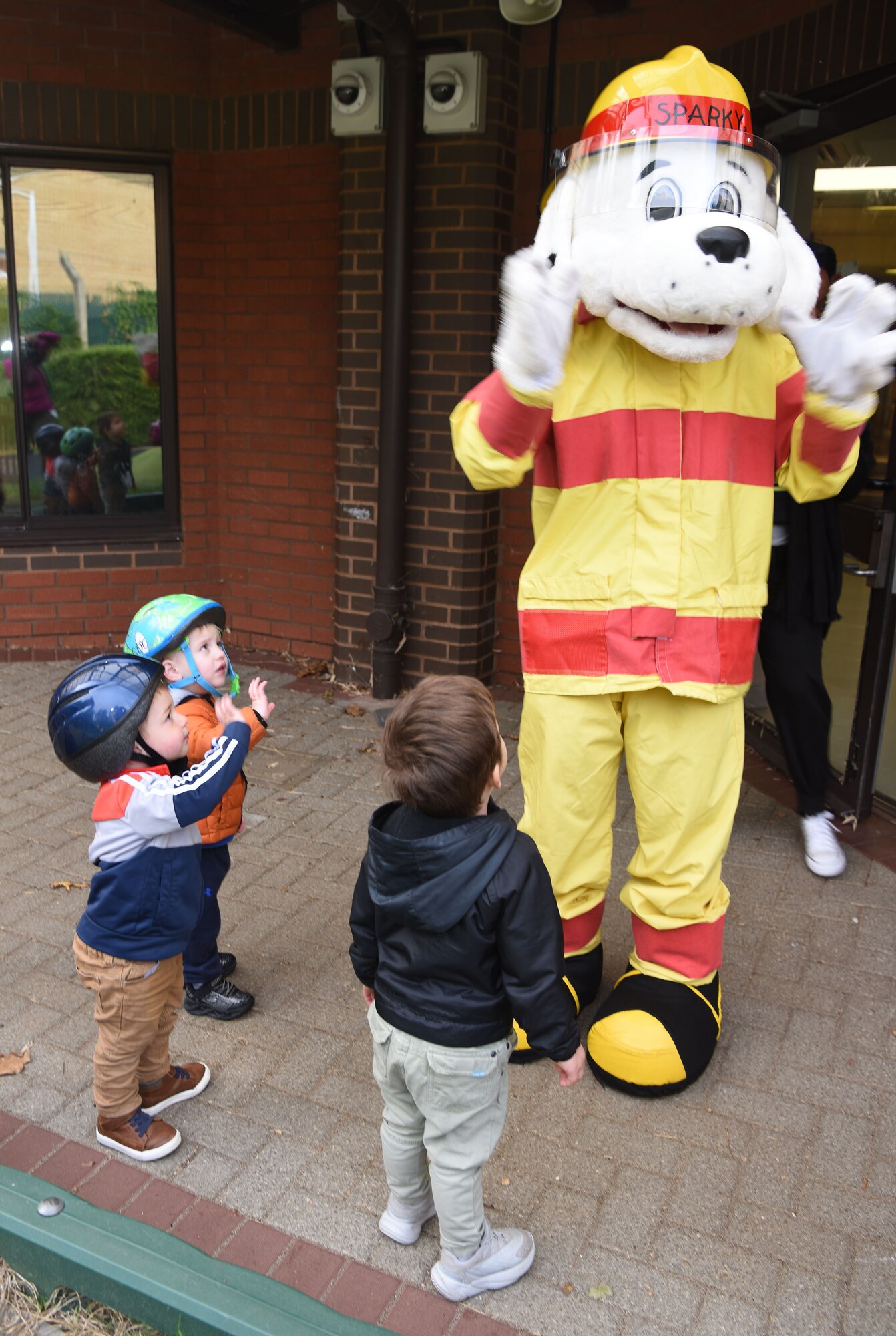 Sparky the Fire Dog and some of his firefighter friends from the 100th Civil Engineer Squadron Fire Department visited pre-schoolers at the child development center as part of Fire Prevention Week at Royal Air Force Mildenhall, England, Oct. 12, 2022. This year’s FPW theme is “Fire won’t wait: Plan your escape.” Other activities included information booths, open house at the fire department, bowling and a fire muster. (U.S. Air Force photo by Karen Abeyasekere)