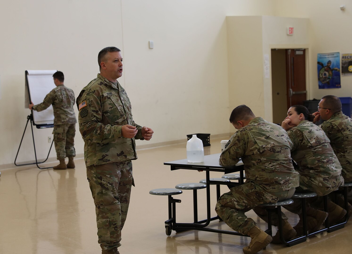 Brig. Gen. Justin Osberg, Deputy Assistant Adjutant General of the Army Illinois Joint Force Headquarters, delivers a brief to Soldiers of the 933rd Military Police Company about Task Force Restore Trust at the North Central Army Reserve Intelligence Support Center, Fort Sheridan, Illinois, September 24, 2022.
