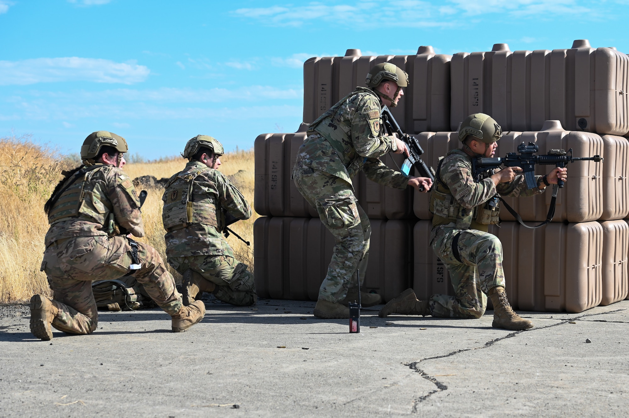 Airmen from the 92nd Security Forces Squadron demonstrate various tactics during a Combat Readiness Training (CRT) exercise at Fairchild Air Force Base, Washington, September 27, 2022. The CRT program places junior enlisted and NCO's in an Agile, Combat, and Employment (ACE) simulation to prepare them for the future fight. (Airman 1st Class Morgan Dailey)