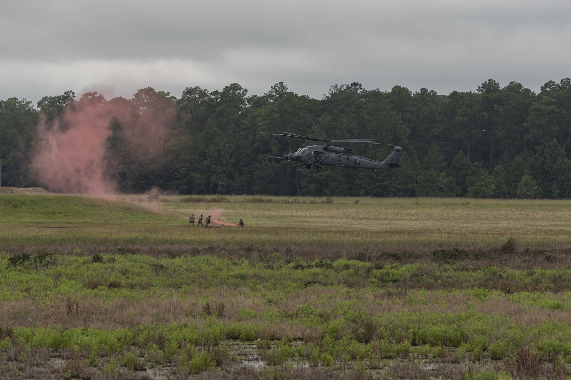 U.S. Air Force Airmen assigned to the 38th Rescue Squadron perform a combat search and rescue demonstration at Moody Air Force Base, Georgia, Sept. 9, 2022. The 23rd Maintenance Group and 347th Rescue Group have successfully postured the HH-60W Jolly Green II capabilities for maximum combat readiness and full integration in rescue operations alongside the HC-130J Combat King II aircraft. (U.S. Air Force photo by Senior Airman Jasmine M. Barnes)