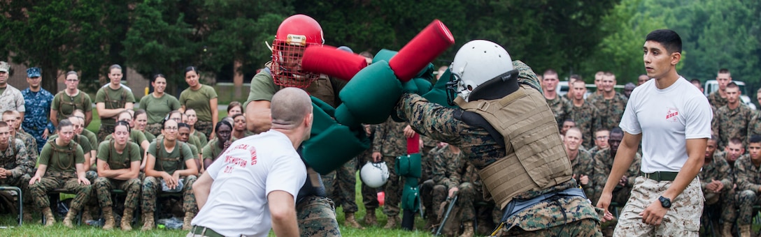 Candidates with Alpha, Charlie, and Delta Company, Officer Candidate School (OCS), compete against each other using pugil sticks aboard Marine Corps Base Quantico, Va., July 30, 2016. The mission of OCS is to educate and train officer candidates in order to evaluate and screen individuals for qualities required for commissioning as a Marine Corps officer. (U.S. Marine Corps Combat Camera photo by Lance Cpl. Jose Villalobosrocha/Released)