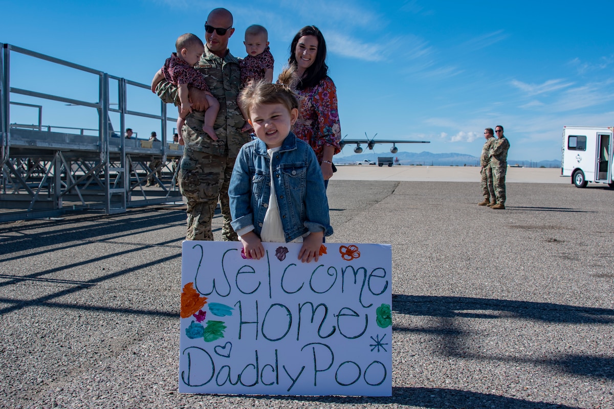 A photo of a family member greeting a loved one that came home from deployment
