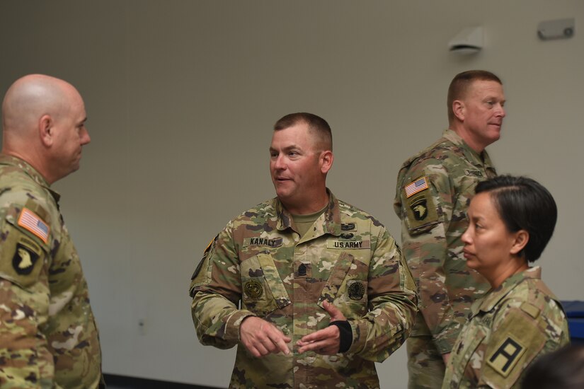 Command Sgt. Major John Kanaly, center, incoming Command Sgt. Major, 120th Infantry Brigade talks with Command Sgt. Major Dina Pang, right, outgoing Command Sgt. Major, 120th Infantry Brigade, and Col. Paul Bonano, Commander, 120th Infantry Brigade, during the 85th U.S. Army Reserve Support Command’s Brigade Command Team Training at Arlington Heights, Illinois, October 15, 2022.