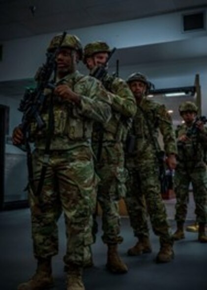 Members of the 91st Security Forces Group prepare to clear and load weapon systems during Exercise Bully Vigilance, at Minot Air Force, North Dakota, Oct. 13, 2022. BV is an semi-annual command and control exercise designed to train U.S. Strategic Command forces and assess joint operational readiness. (U.S. Air Force photo by Senior Airman China Shock)