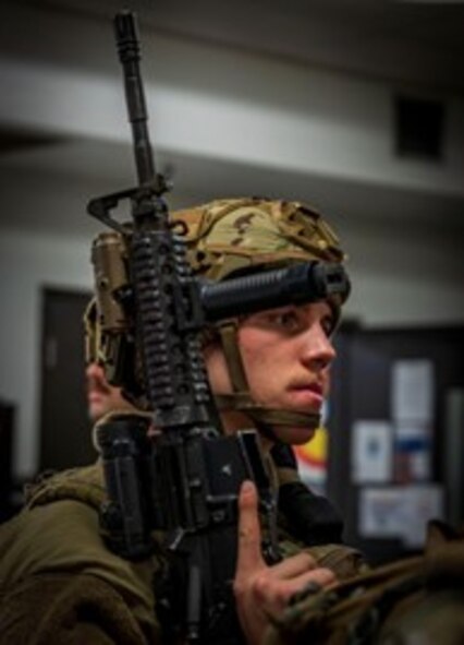 A 91st Security Forces Group defender holds a M4 Carbine during Exercise Bully Vigilance, at Minot Air Force, North Dakota, Oct. 13, 2022. BV is an semi-annual command and control exercise designed to train U.S. Strategic Command forces and assess joint operational readiness. (U.S. Air Force photo by Senior Airman China Shock)