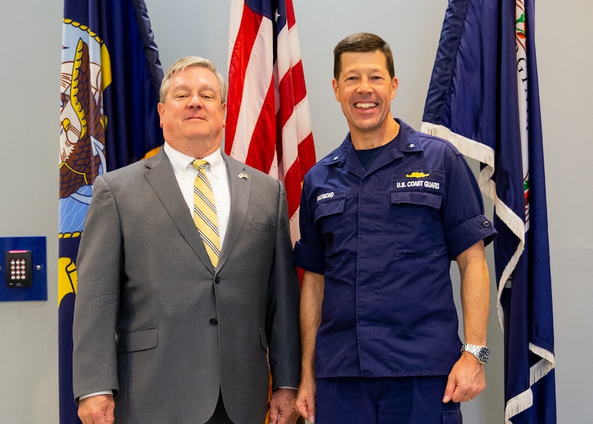 Rear Admiral Joe Raymond being greeted by Director Durkin onboard NWDC