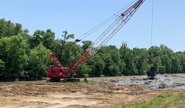 Quality Assurance photo of the Locust Creek project site in Craighead County, Arkansas. The creek is part of the St. Francis River Basin and required approximately 12,000 linear feet of sediment removal. A $1,289,305 contract was awarded to Innovative Performance Construction Company to complete the needed two miles of excavation.

"The purpose of this project was to improve drainage along the Locust Creek area," Wynn Area Office Civil Engineer Jason Britt said. "Improvements to drainage will reduce standing water upstream of the project area, thereby reducing the amount of standing water against the levees."

To clear the creek, the contractor removed material from the channel using a dragline before placing the excavated material in the levee as Excavated Material Embankment (EME). In partnership with the St. Francis Levee District of Arkansas, construction began on Oct. 15, 2021. It was declared substantially complete on Jul. 9, 2022.