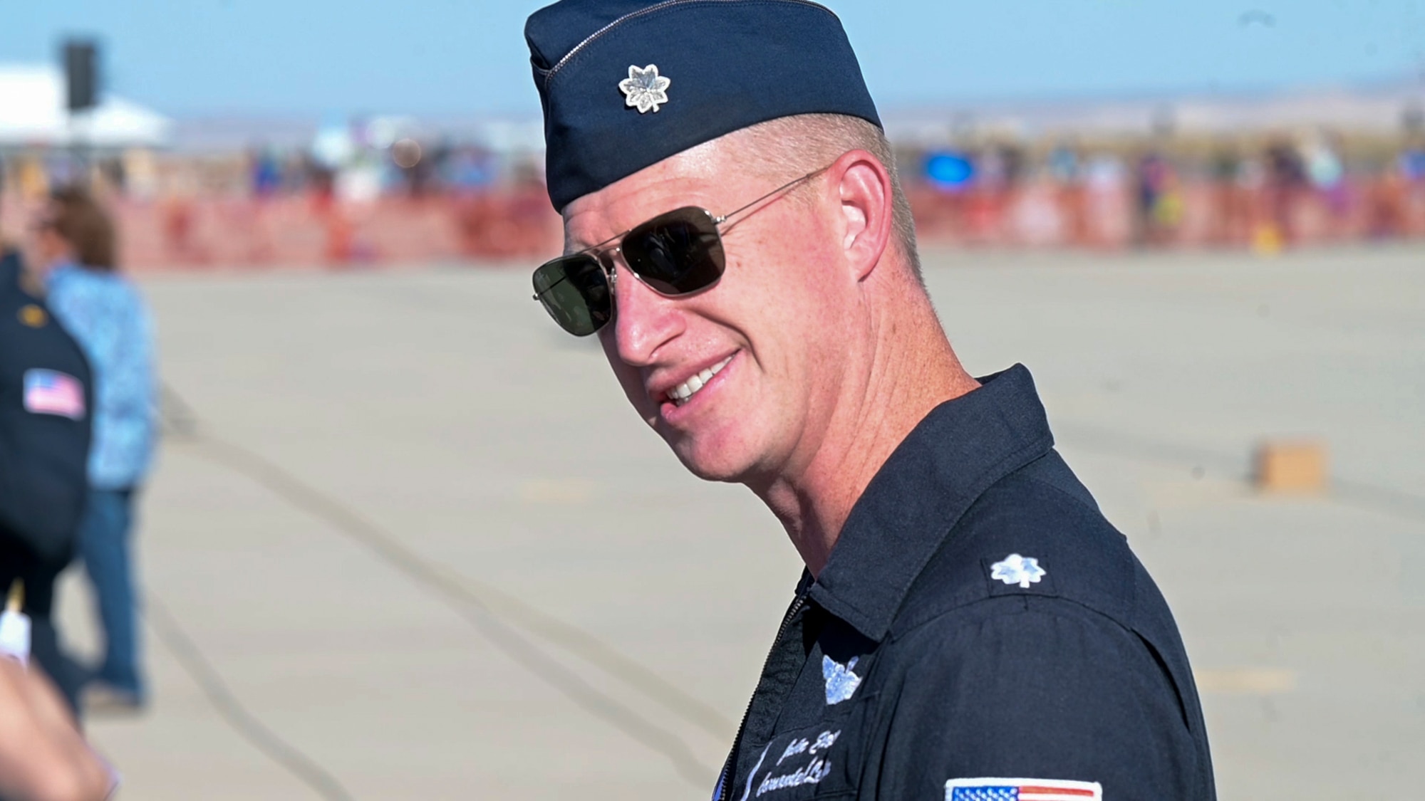 Lt. Col. Justin "Astro" Elliott, USAF Thunderbirds Commander, signs autographs during the 2022 Aerospace Valley Air Show at Edwards Air Force Base. (U.S. Air Force photo by Adam Bowles)