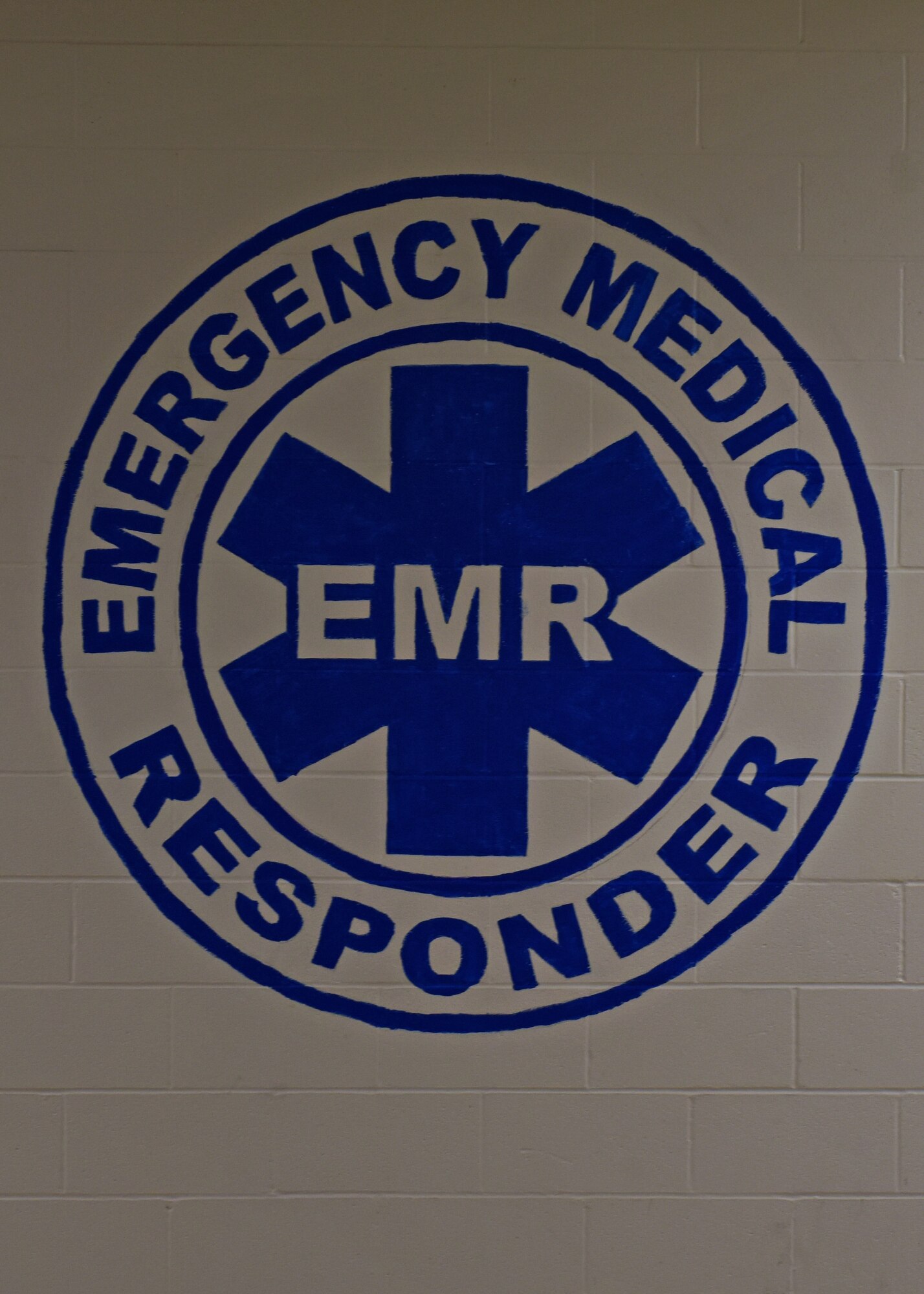 An emergency medical responder sign is displayed on a wall at the Louis F. Garland Department of Defense Fire Academy, Goodfellow Air Force Base, Texas, Oct. 13, 2022. EMR is the first course students take during their three months of fire training. (U.S. Air Force photo by Airman 1st Class Sarah Williams)