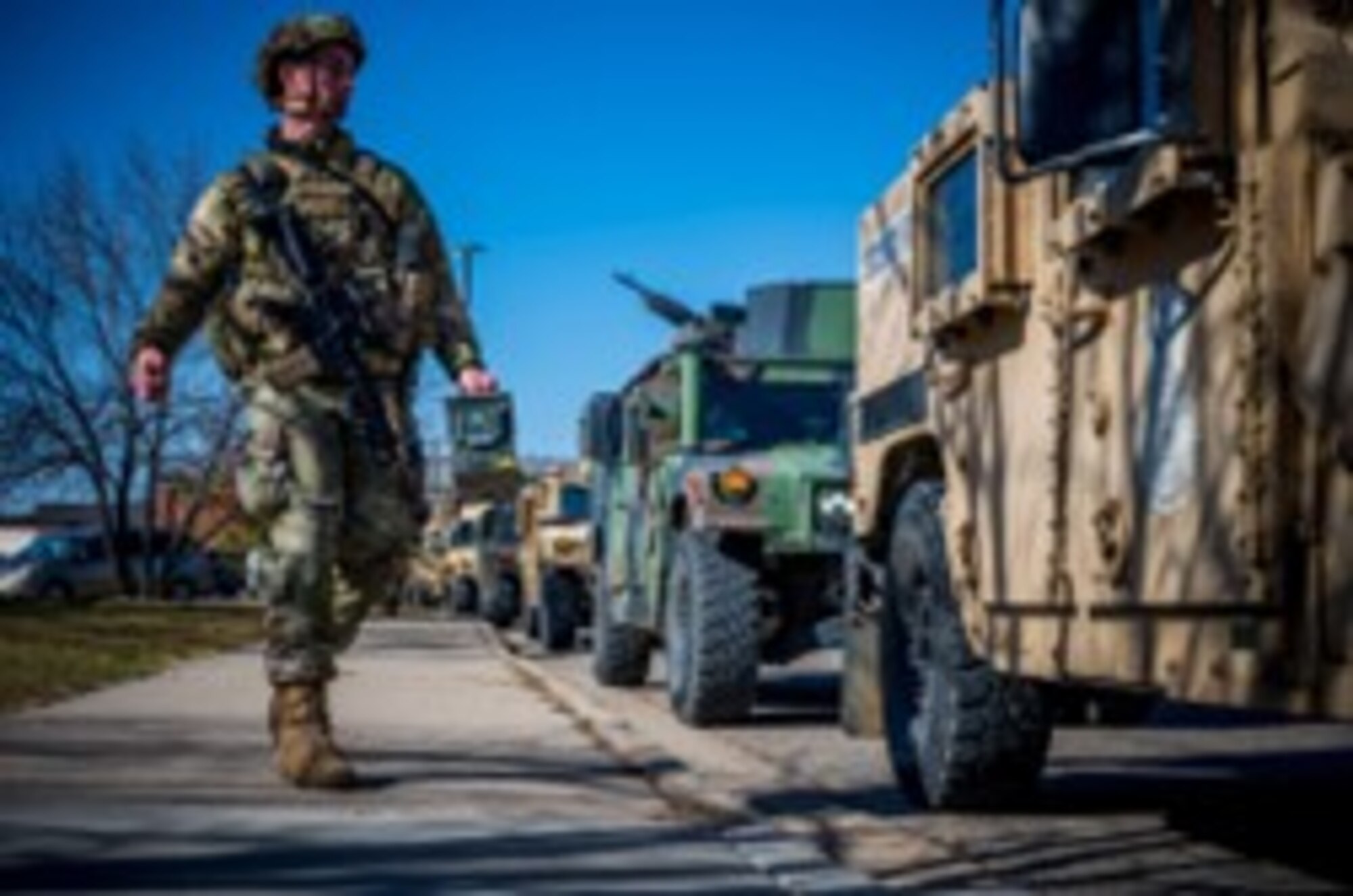 A 91st Security Forces Group defender approaches a High Mobility Multipurpose Wheeled Vehicles (HMMWV) during Exercise Bully Vigilance at Minot Air Force, North Dakota, Oct. 13, 2022. Exercises like BV provide training opportunities for components, units and task forces to deter, and if necessary defeat, a military attack against the United States and to employ forces as directed by the President. (U.S. Air Force by Senior Airman China Shock)