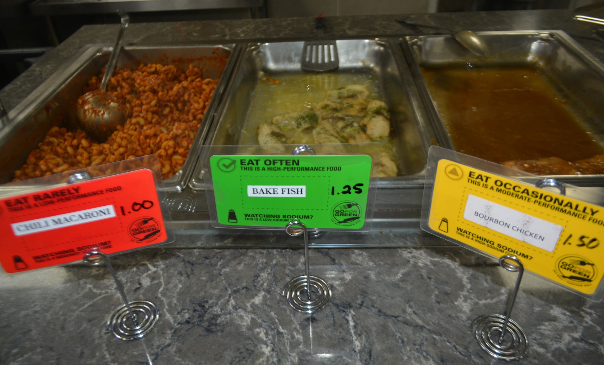 Menu items are displayed on color-coded placards as part of the "Go For Green" initiative to guide service members, retirees and civilians to healthier food choices at the Freedom Hall Dining Facility at Joint Base Andrews, Md., Oct. 4, 2022.