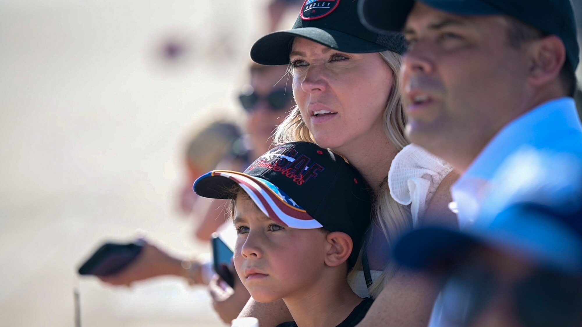 Spectators watch as the USAF Thunderbirds perform precision aerial maneuvers during the 2022 Aerospace Valley Air Show at Edwards Air Force Base. (U.S. Air Force photo by Adam Bowles)