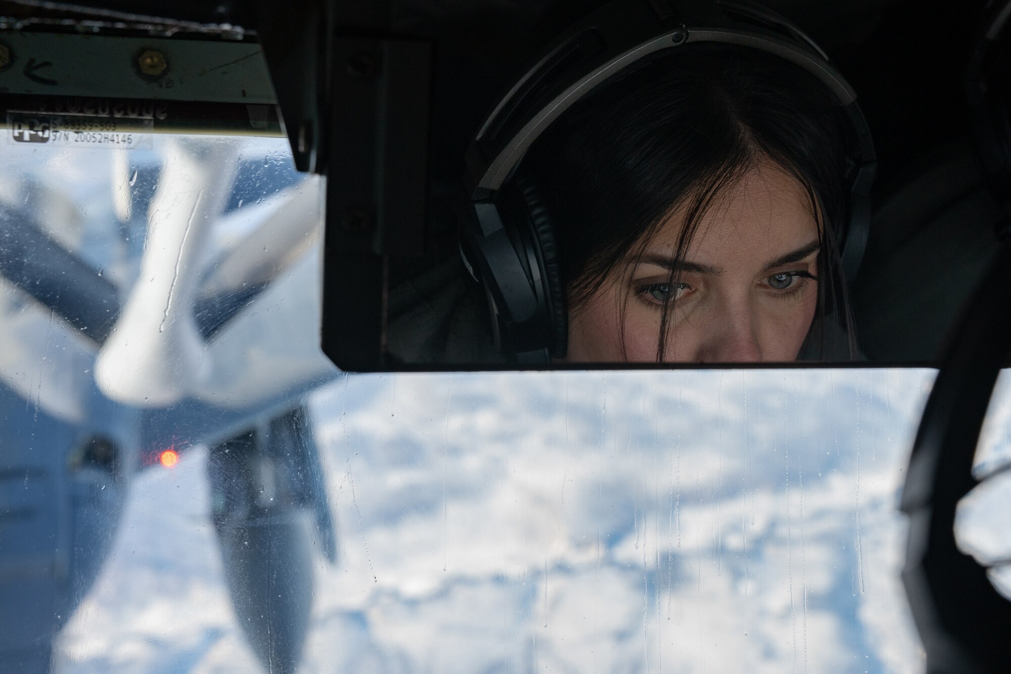 Airman 1st Class Stephanie Peraza refuels a plane