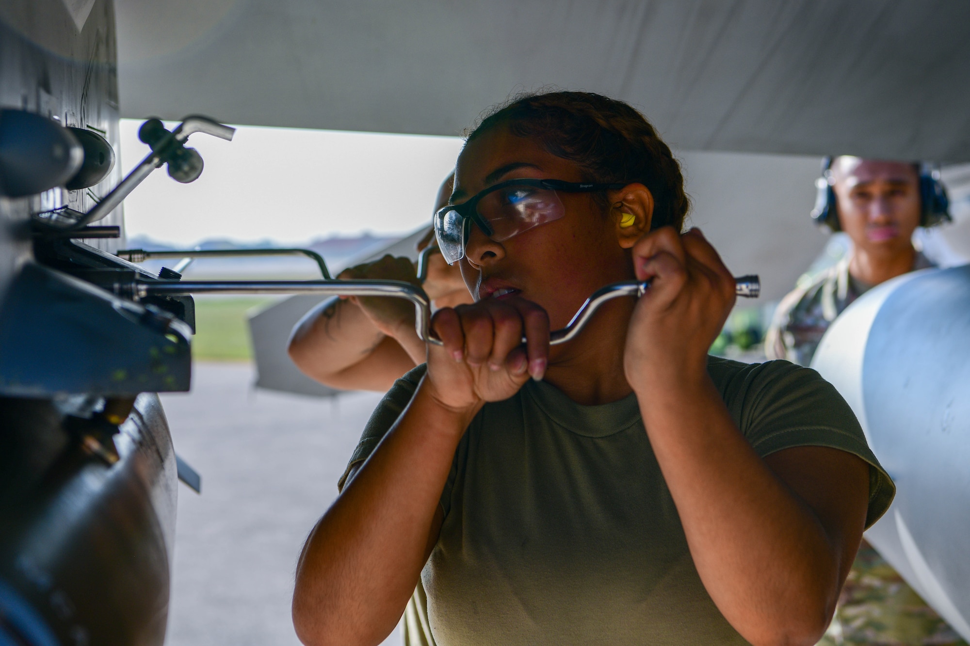 Airman 1st Class Lynmarie Mateo, 555th Fighter Generation Squadron weapons load crew member, tightens a bolt on an F-16 Fighting Falcon during the 3rd quarter Rapid Aircraft Generation and Employment (RAGE) event at Aviano Air Base, Italy, Oct. 14, 2022. RAGE features demonstrations and competitions that display the base’s ability to communicate, coordinate and execute wartime operations. (U.S. Air Force photo by Senior Airman Brooke Moeder)