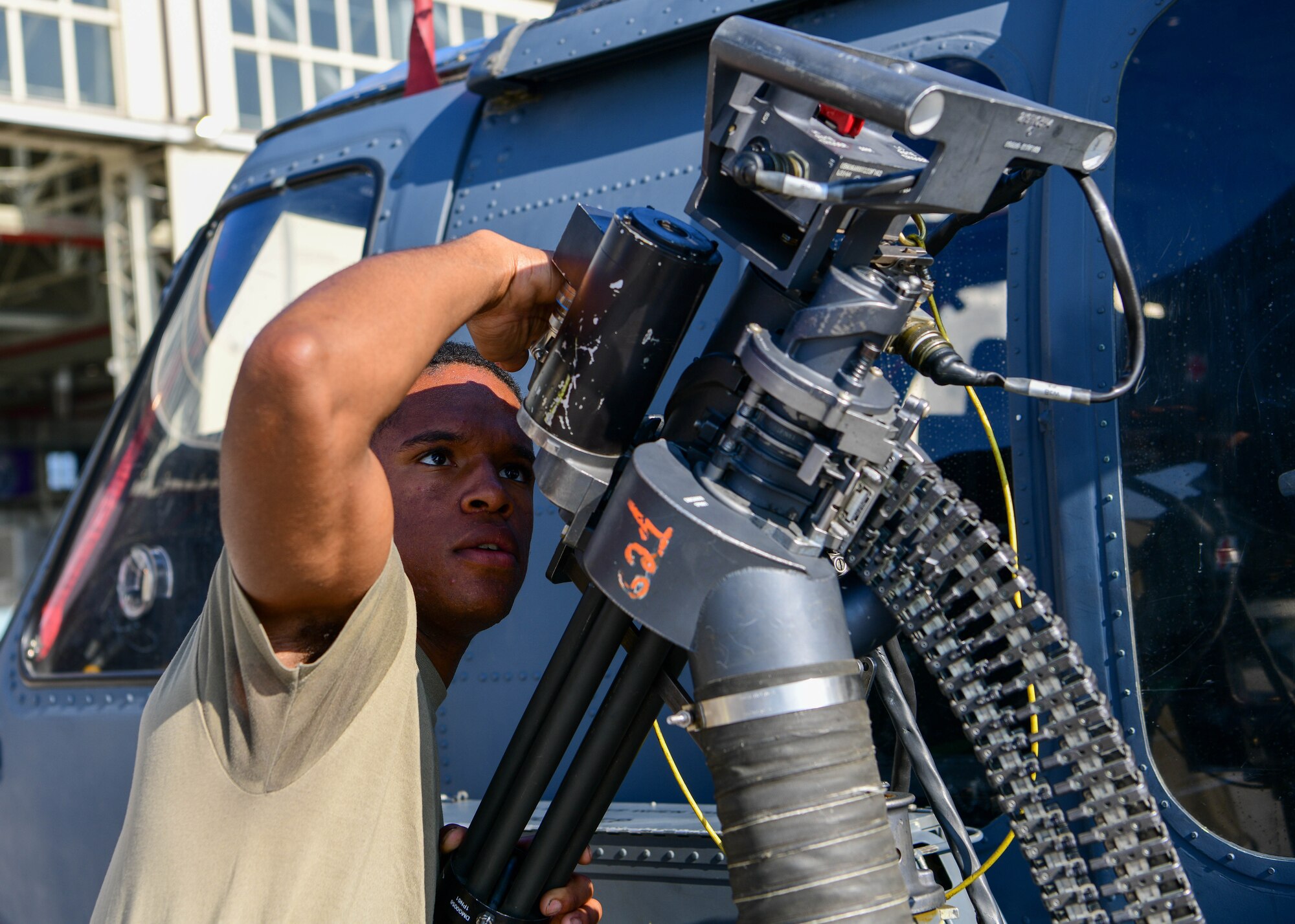 Airman 1st Class Elijah Campbell, 56th Rescue Generation Squadron HH-60 apprentice, inspects a .50-caliber gun system on an HH-60G Pave Hawk during the 3rd quarter Rapid Aircraft Generation and Employment (RAGE) event at Aviano Air Base, Italy, Oct.14, 2022. The 31st Fighter Wing hosts the 56th Rescue Squadron, providing a rapidly deployable, worldwide combat rescue and reaction force response utilizing HH-60G Pave Hawk helicopters. (U.S. Air Force photo by Senior Airman Brooke Moeder)