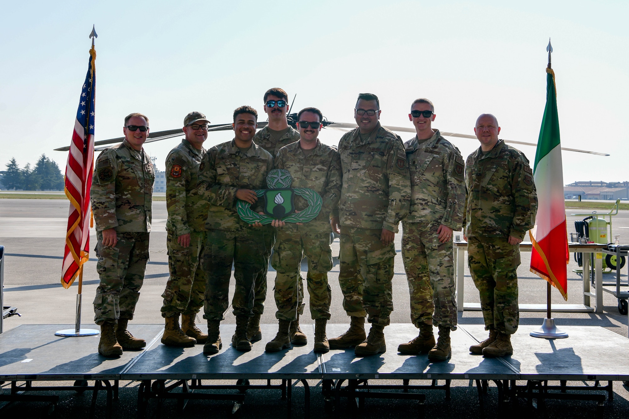 U.S. Air Force Airmen assigned to the 31st Munitions Squadron pose for a photo at Aviano Air Base, Italy, Oct. 14, 2022. The “Jackleman Brown” team won first place in the inert Bomb Build competition during a Rapid Aircraft Generation and Employment (RAGE) event by building a guided bomb unit-31v3 Joint Direct Attack Munition (JDAM) in the least amount of time with the highest accuracy. (U.S. Air Force photo by Senior Airman Brooke Moeder)