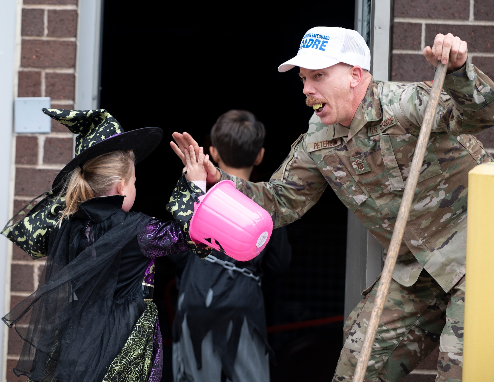 U.S. Air Force Airmen from the 133rd Airlift Wing handed out candy during a Halloween parade in St. Paul, Oct. 16, 2022.