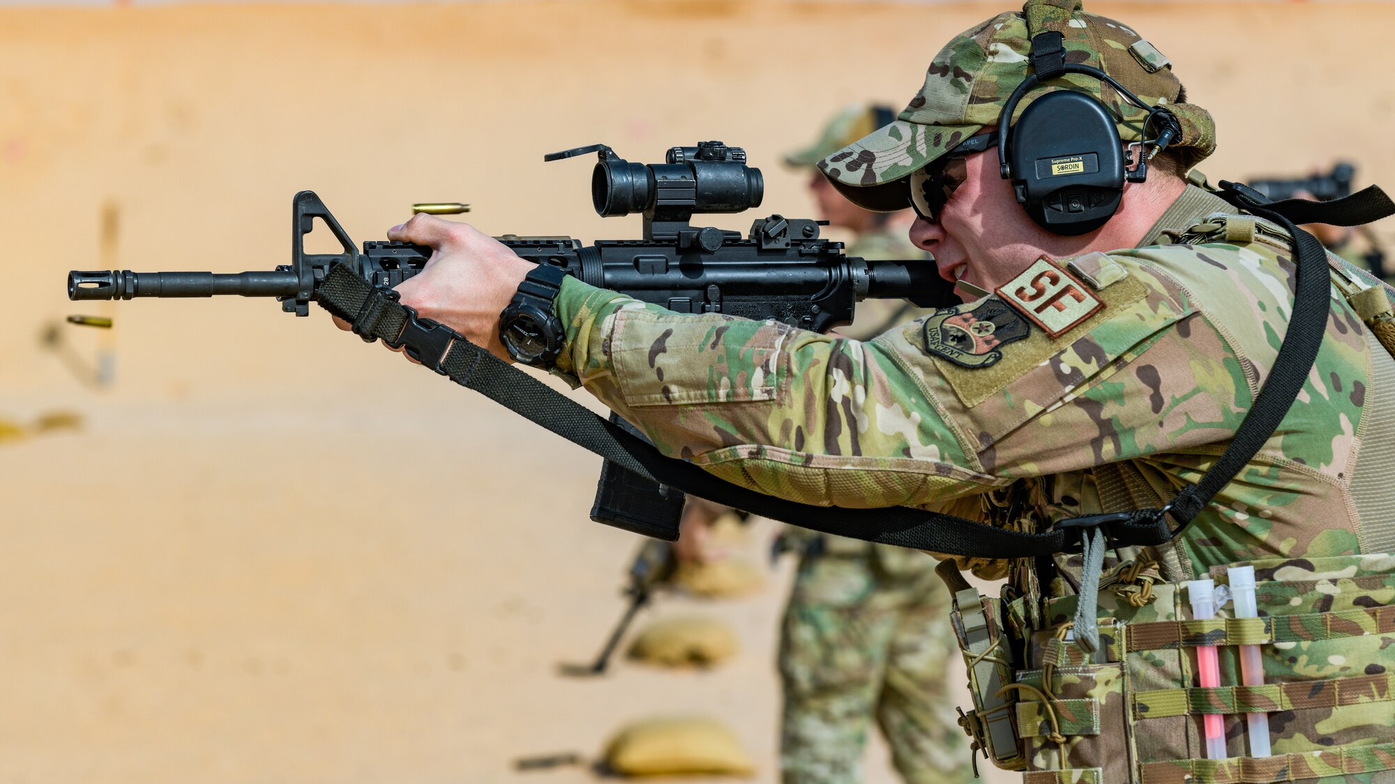 Photo of Airman firing a rifle