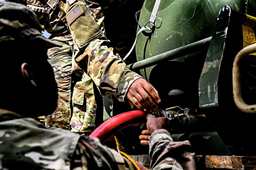 U.S. Army Soldiers assigned to the U.S. Army 58th Troop Command set up a water filtration unit at Joint Base McGuire-Dix-Lakehurst, N.J. on Oct. 17, 2022. Shower, Laundry, and Clothing Repair Specialists are primarily responsible for supervising and performing laundry, shower, personnel and clothing decontamination functions. These capabilities are essential to the health and welfare of soldiers in training or deployed environments. Good hygiene is required by all who are subject to the laws and regulations defined by the UCMJ in order to prevent the spread of disease that may compromise mission success.