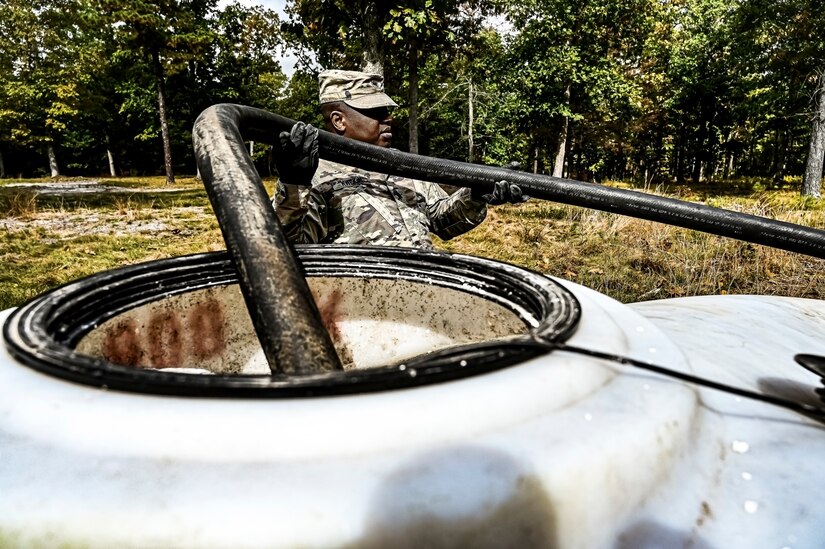 A U.S. Army Soldier assigned to the U.S. Army 58th Troop Command set up a water filtration unit at Joint Base McGuire-Dix-Lakehurst, N.J. on Oct. 17, 2022. Shower, Laundry, and Clothing Repair Specialists are primarily responsible for supervising and performing laundry, shower, personnel and clothing decontamination functions. These capabilities are essential to the health and welfare of soldiers in training or deployed environments. Good hygiene is required by all who are subject to the laws and regulations defined by the UCMJ in order to prevent the spread of disease that may compromise mission success.