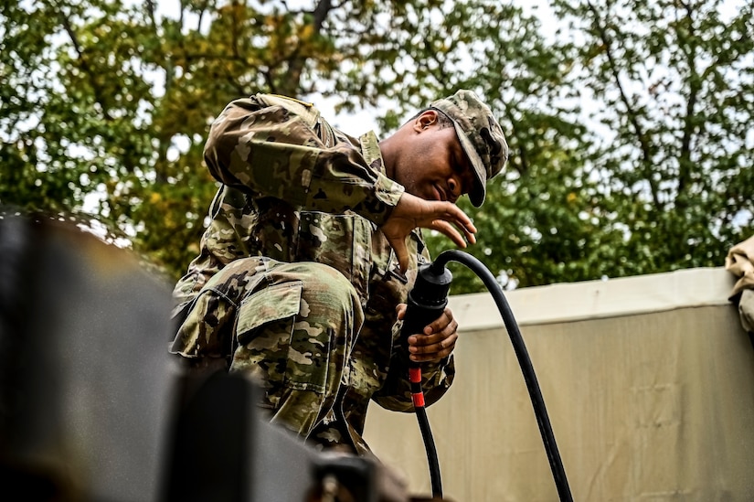 A U.S. Army Soldier assigned to the U.S. Army 58th Troop Command set up a water filtration unit at Joint Base McGuire-Dix-Lakehurst, N.J. on Oct. 17, 2022. Shower, Laundry, and Clothing Repair Specialists are primarily responsible for supervising and performing laundry, shower, personnel and clothing decontamination functions. These capabilities are essential to the health and welfare of soldiers in training or deployed environments. Good hygiene is required by all who are subject to the laws and regulations defined by the UCMJ in order to prevent the spread of disease that may compromise mission success.