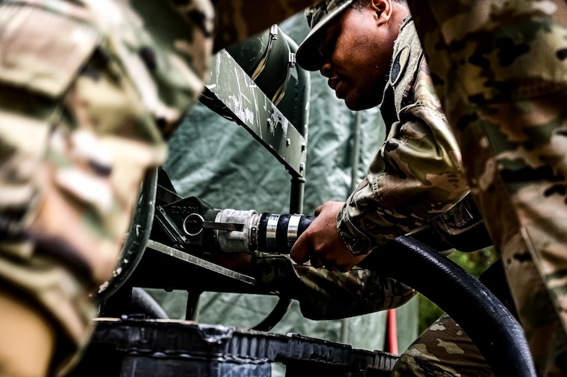 U.S. Army Soldiers assigned to the U.S. Army 58th Troop Command set up a water filtration unit at Joint Base McGuire-Dix-Lakehurst, N.J. on Oct. 17, 2022. Shower, Laundry, and Clothing Repair Specialists are primarily responsible for supervising and performing laundry, shower, personnel and clothing decontamination functions. These capabilities are essential to the health and welfare of soldiers in training or deployed environments. Good hygiene is required by all who are subject to the laws and regulations defined by the UCMJ in order to prevent the spread of disease that may compromise mission success.