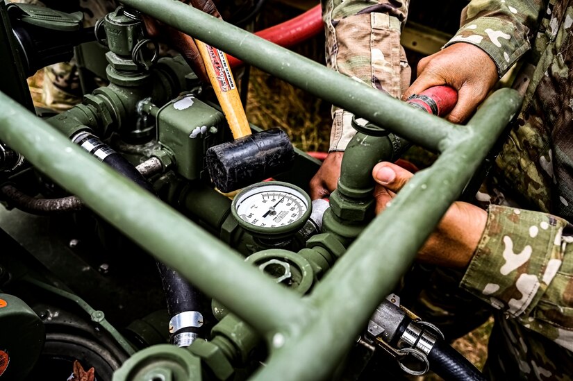 U.S. Army Soldiers assigned to the U.S. Army 58th Troop Command set up a water filtration unit at Joint Base McGuire-Dix-Lakehurst, N.J. on Oct. 17, 2022. Shower, Laundry, and Clothing Repair Specialists are primarily responsible for supervising and performing laundry, shower, personnel and clothing decontamination functions. These capabilities are essential to the health and welfare of soldiers in training or deployed environments. Good hygiene is required by all who are subject to the laws and regulations defined by the UCMJ in order to prevent the spread of disease that may compromise mission success.