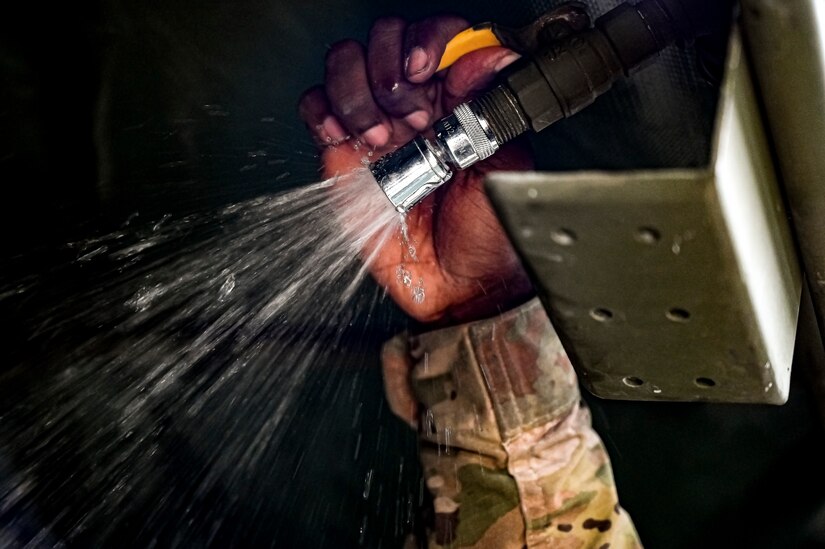 A U.S. Army Soldier assigned to the U.S. Army 58th Troop Command tests a portable shower unit at Joint Base McGuire-Dix-Lakehurst, N.J. on Oct. 17, 2022. Shower, Laundry, and Clothing Repair Specialists are primarily responsible for supervising and performing laundry, shower, personnel and clothing decontamination functions. These capabilities are essential to the health and welfare of soldiers in training or deployed environments. Good hygiene is required by all who are subject to the laws and regulations defined by the UCMJ in order to prevent the spread of disease that may compromise mission success.