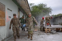 U.S. Army Cpl. Ryan Burns and Sgt. Alex Bustos, both assigned to the 520th Area Support Medical Company, 56th Multifunctional Medical Battalion, 62nd Medical Brigade, and Mexican army personnel assigned to the 19th Motorized Cavalry Regiment carry a simulated casualty from a notional disaster zone during exercise Fuerzas Amigas 2022 at Campo Militar Reynosa, Mexico, Oct. 18, 2022.