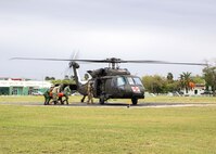 U.S. Soldiers assigned to the 520th Area Support Medical Company, 56th Multifunctional Medical Battalion, 62nd Medical Brigade and Mexican army personnel assigned to the 19th Motorized Cavalry Regiment transport a simulated casualty to an HH-60M Blackhawk helicopter attached to the 2nd Battalion, 3rd General Support Aviation Regiment during medical evacuation training as part of exercise Fuerzas Amigas 2022 at Campo Militar Reynosa, Mexico, Oct. 18, 2022.