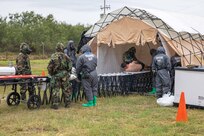 U.S. Soldiers assigned to the 526th Engineer Company, 92nd Engineer Battalion, 20th Engineer Brigade, from Fort Stewart, Ga., and Mexican army soldiers assigned to the 19th Motorized Cavalry Regiment conduct simulated mass decontamination training during exercise Fuerzas Amigas 2022 at Campo Militar Reynosa, Mexico, Oct. 18, 2022.