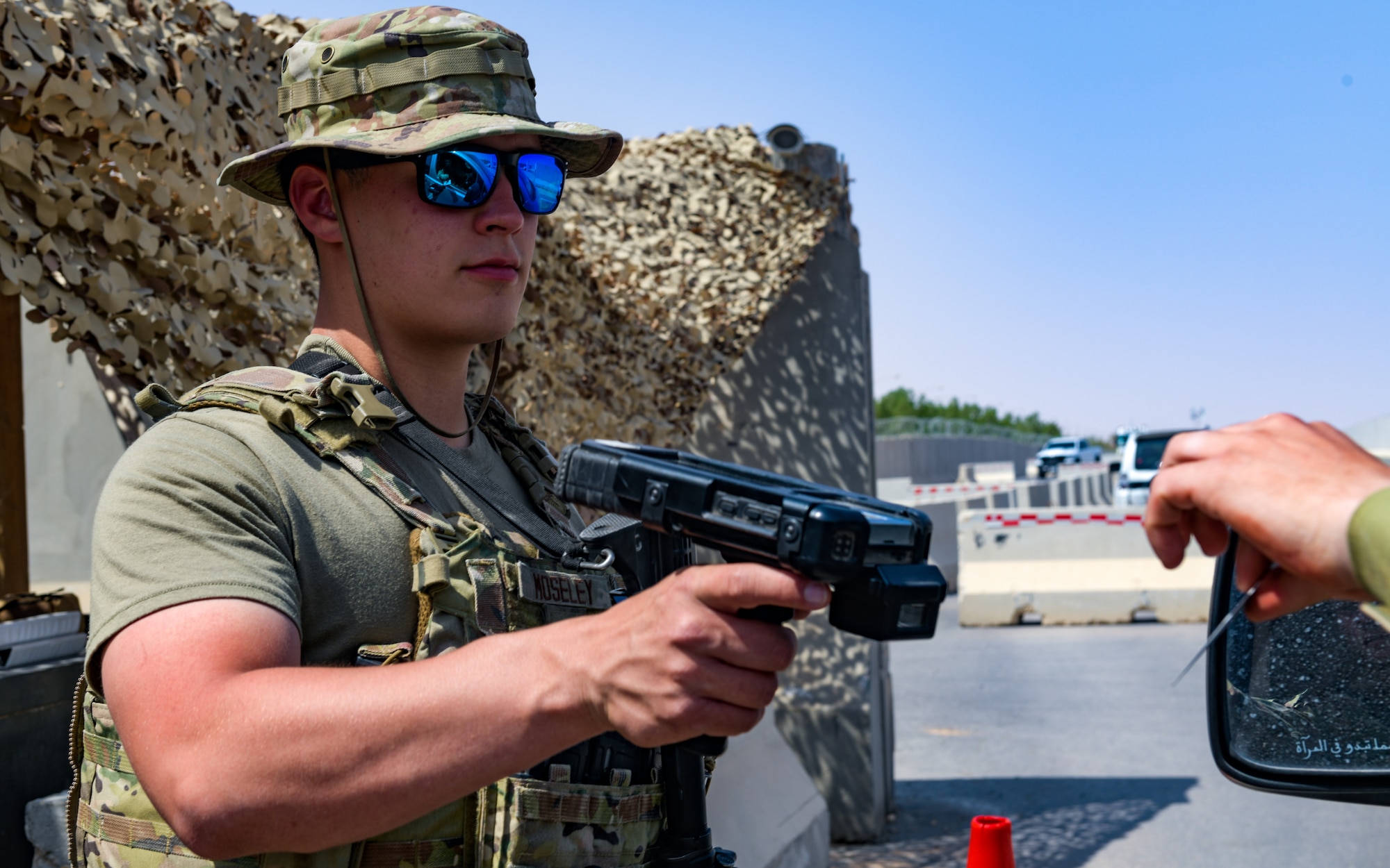 Photo of Airman checking id cards